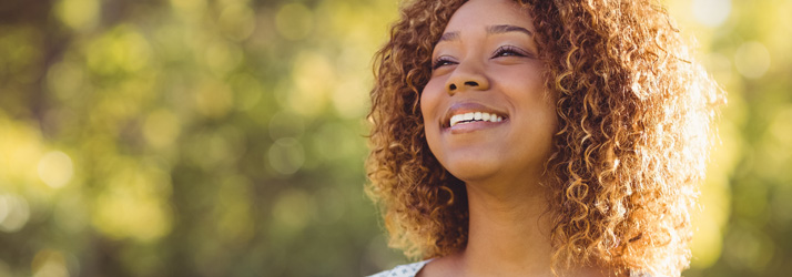 Chiropractic Virginia Beach VA Woman Smiling in the Sun