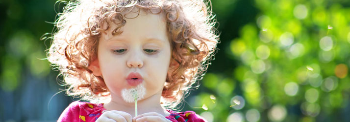 Chiropractic Virginia beach VA Child Girl Blowing A Dandelion